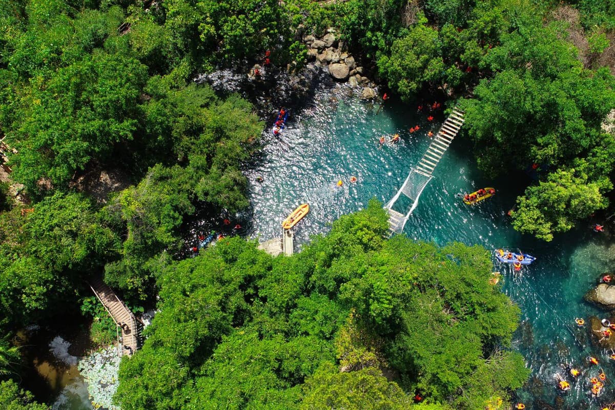 Nuoc Mooc Spring features beautiful scenery, spacious water activities, and forest trails